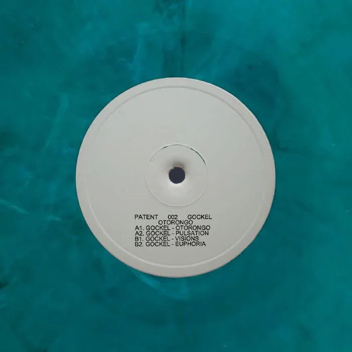 White vinyl record with tracklist text on label, set against a turquoise background