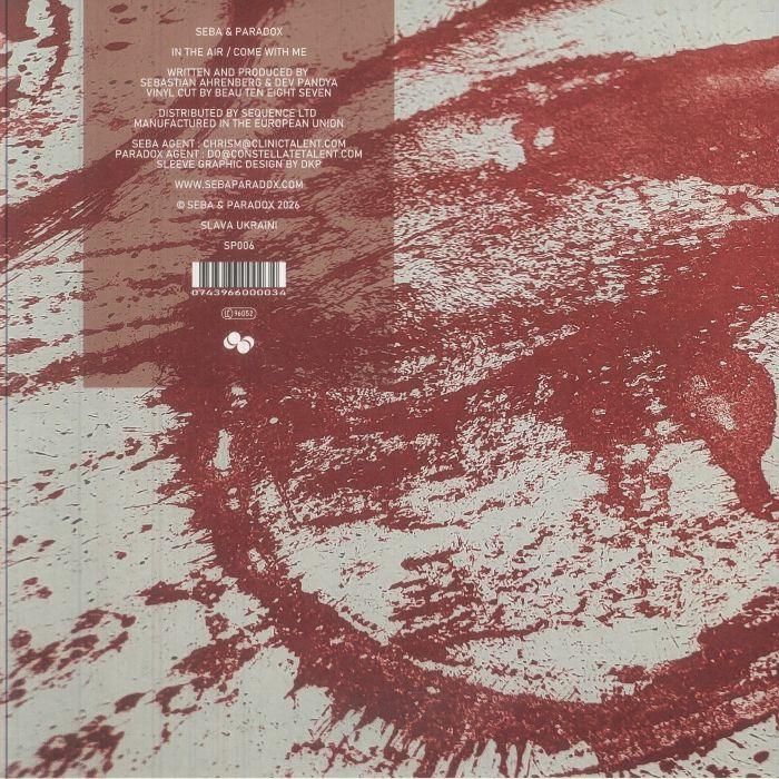 Abstract red paint splatter design with vinyl record tracklist and barcode details.