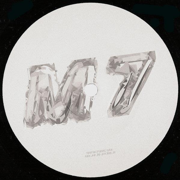 Vinyl record label with metallic M7 text on a white background, electronic music album