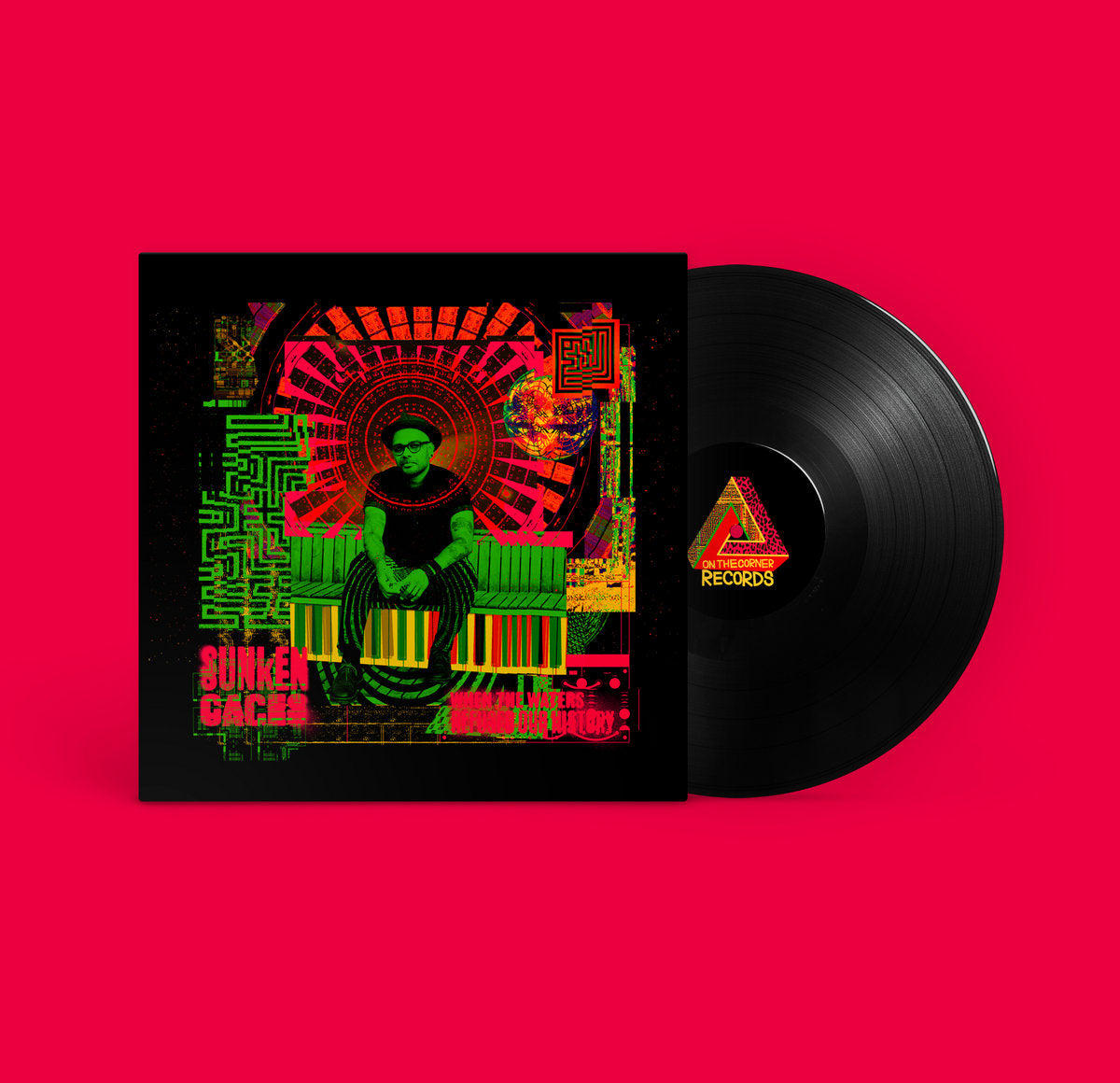 Vinyl record and album cover with a man in hat and glasses sitting on piano keys, colorful abstract art