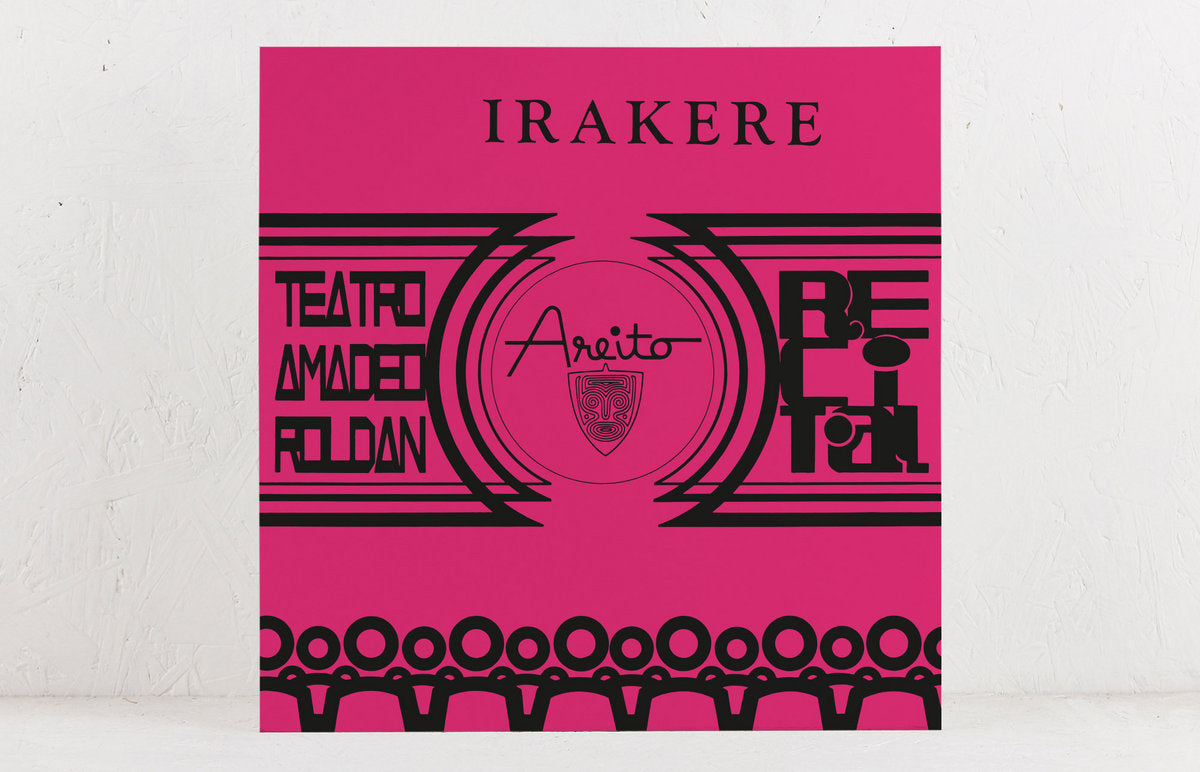 Pink album cover with black geometric designs and text Irakere Teatro Amadeo Roldan Areito Recital