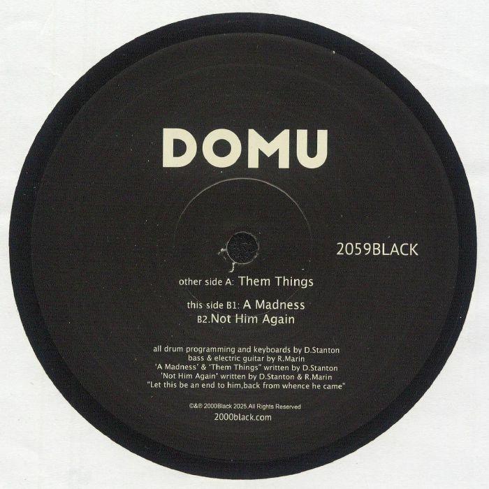 DOMU vinyl record label with tracklist including Them Things, A Madness, Not Him Again