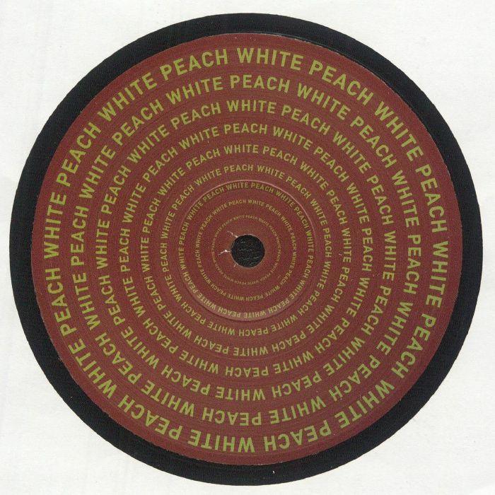 Vinyl record with repeat 'White Peach' text in yellow on brown circular label.