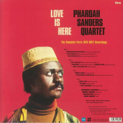 Pharoah Sanders Quartet Love Is Here album cover with portrait, red background, jazz vinyl.