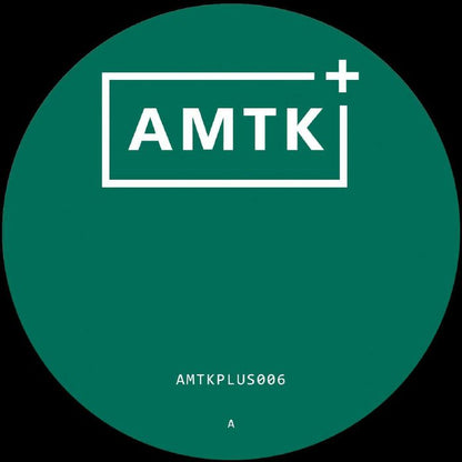 Green circular label with white AMTK plus logo and text AMTKPLUS006 at bottom
