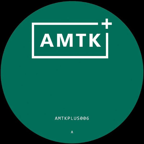 Green circular label with white AMTK plus logo and text AMTKPLUS006 at bottom