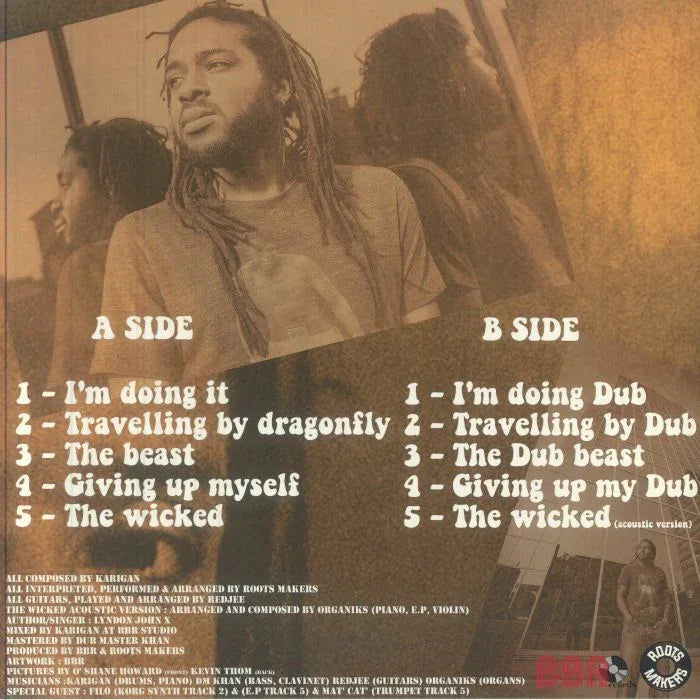 Back cover of a reggae vinyl record with song tracklists, sepia-toned image of man with dreadlocks.