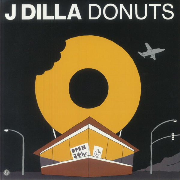 Album cover for 'J Dilla Donuts' with a large yellow donut and a small building underneath.