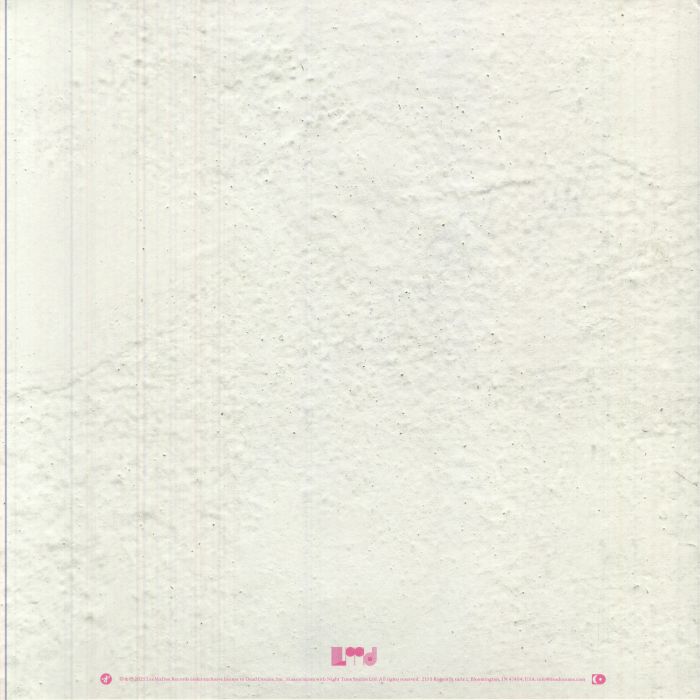 Close-up of textured white fabric with a brand logo at the bottom.