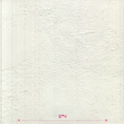 Close-up of textured white fabric with a brand logo at the bottom.