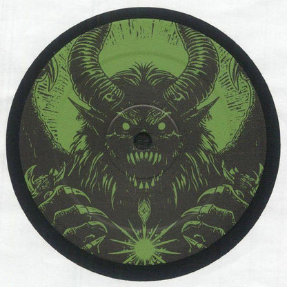 Vinyl record with green monster artwork, featuring horns, sharp teeth, and glowing orb