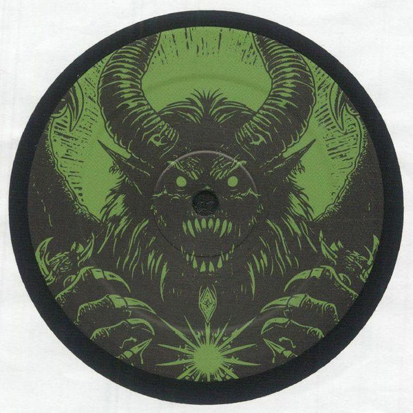 Vinyl record with green monster artwork, featuring horns, sharp teeth, and glowing orb