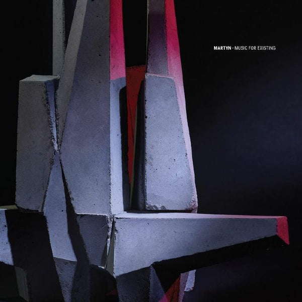 Abstract geometric sculpture with red and gray colors on a black background