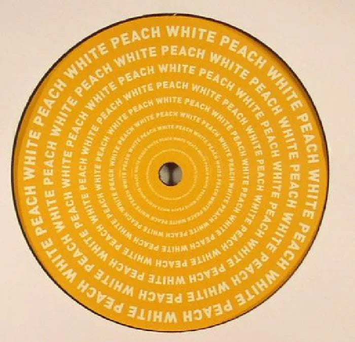Yellow vinyl record with 'WHITE PEACH' text in concentric circles, close-up view.