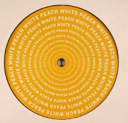 Yellow vinyl record with 'WHITE PEACH' text in concentric circles, close-up view.