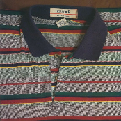 Kiefer striped polo shirt with navy collar and multicolor horizontal stripes, labeled kickinit alone