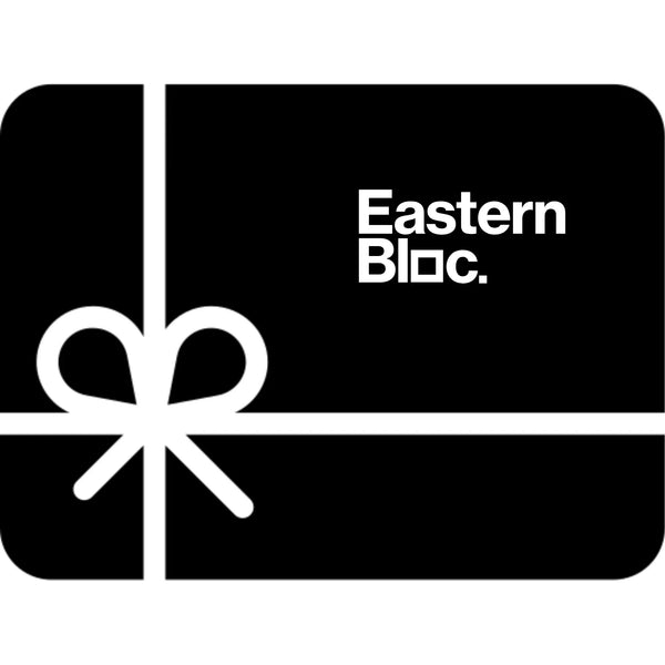 Black gift card with white bow and bold Eastern Bloc. text logo in modern font