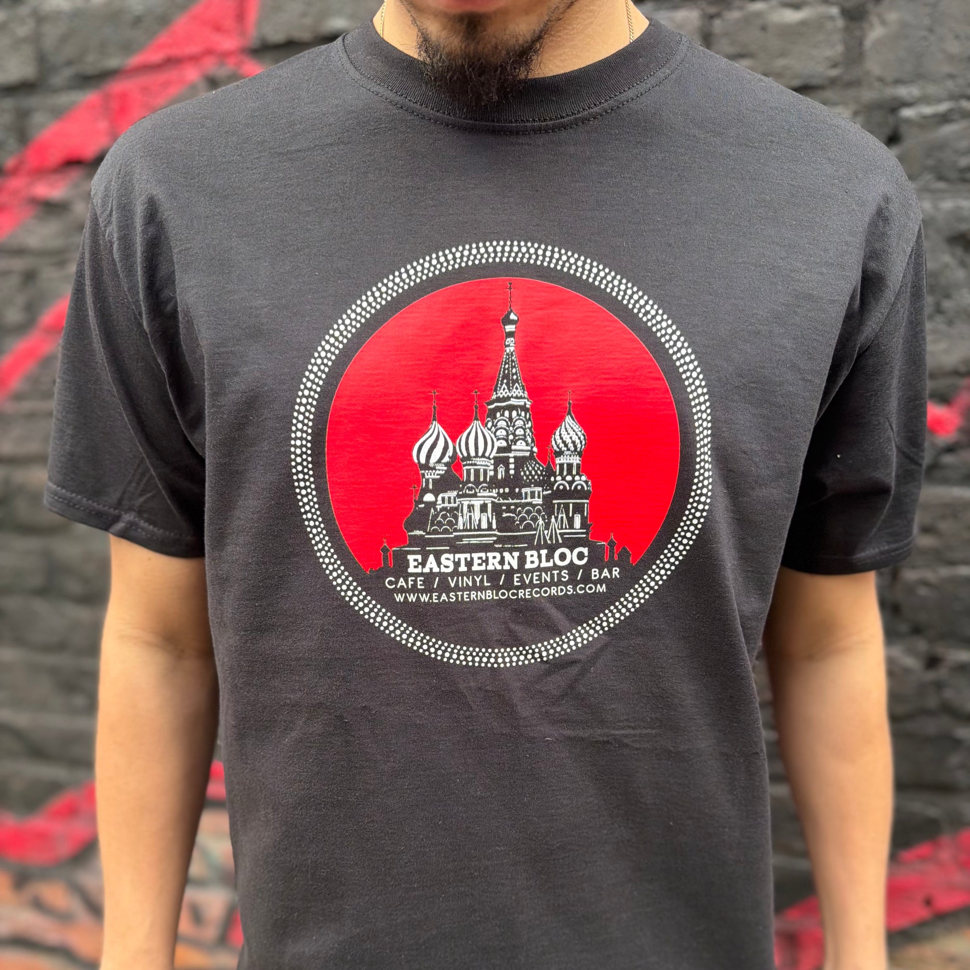 Man wearing black t-shirt with Eastern Bloc logo and St. Basil's Cathedral graphic