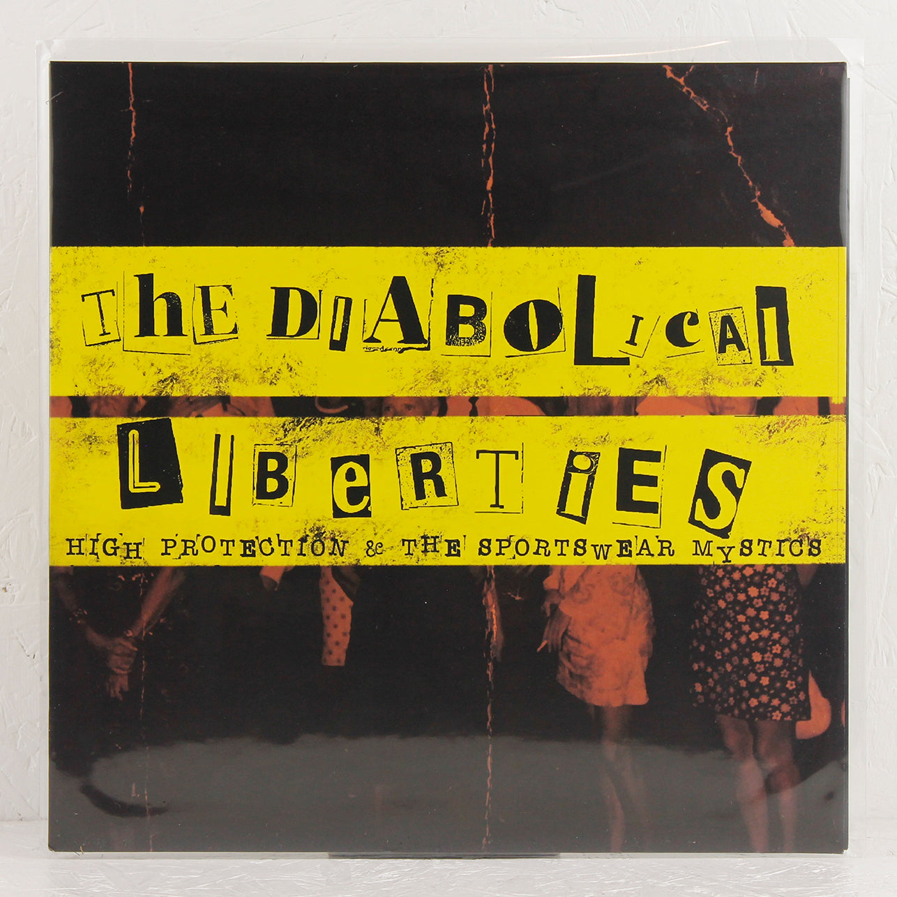 The Diabolical Liberties album cover with yellow ransom note style text on black background